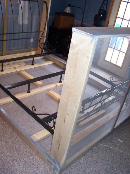 Place the bedframe on top of the wooden bottom frame.JPG