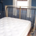 The bedframe fits snugly inside the cage.JPG