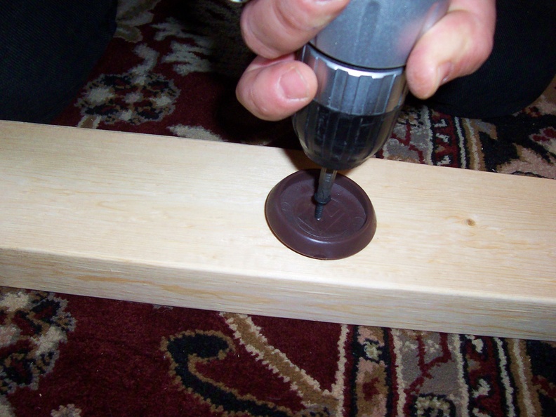 drill furniture coasters onto spots where the bedframe will rest.JPG